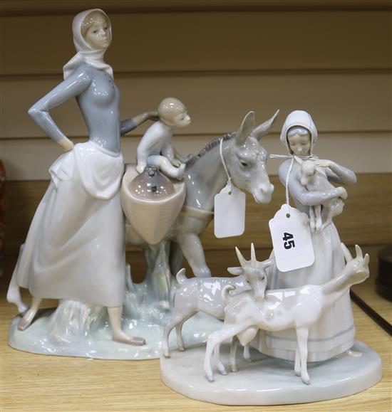 A Lladro large figure group, woman with child and donkey and another of a woman with three goats 35cm